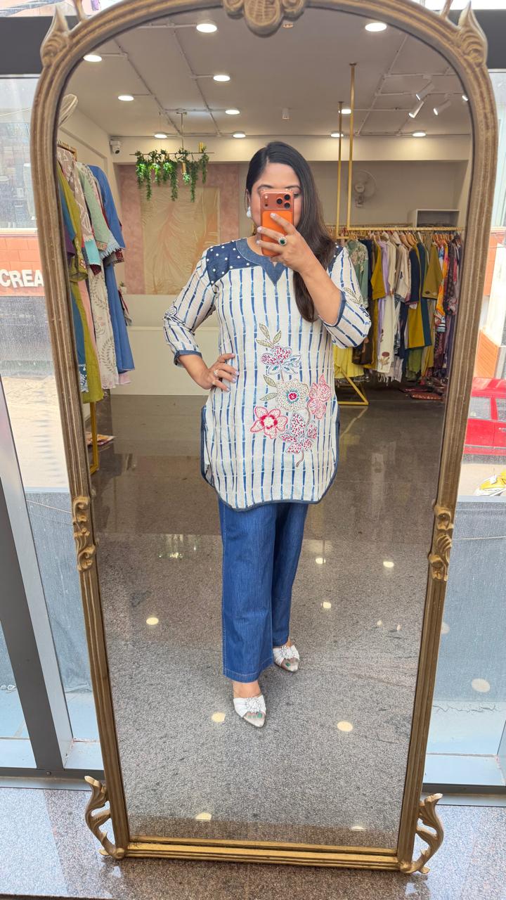 Soft linen applique work kurta paired with soft denim pant
