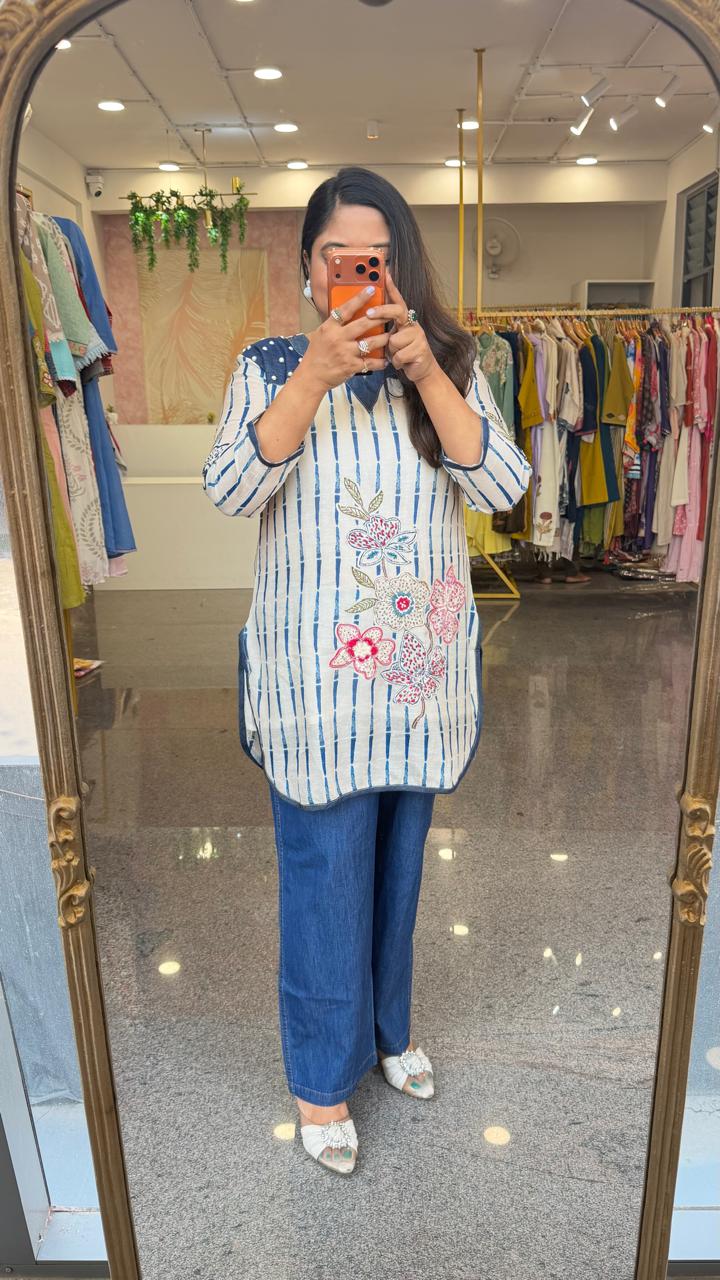 Soft linen applique work kurta paired with soft denim pant